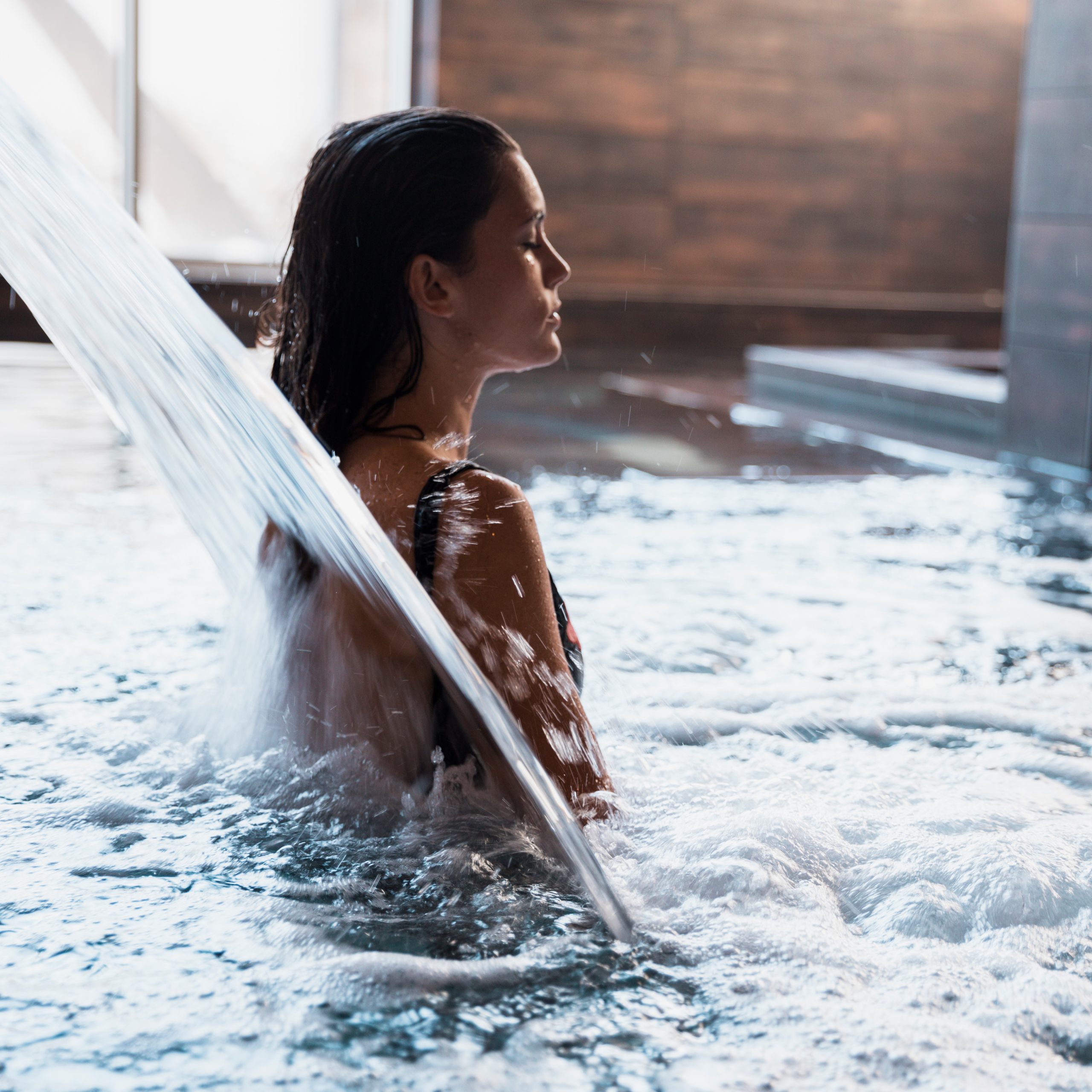spa concept with woman relaxing water 1 scaled